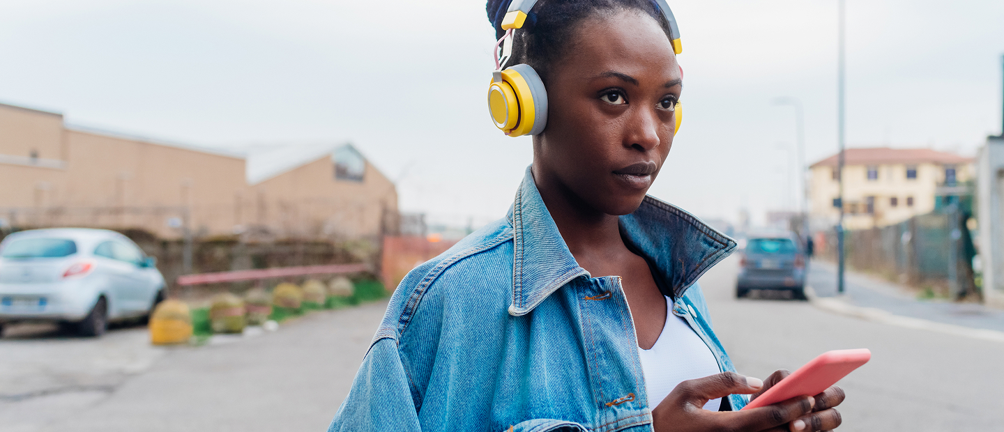 Woman with headphones in denim